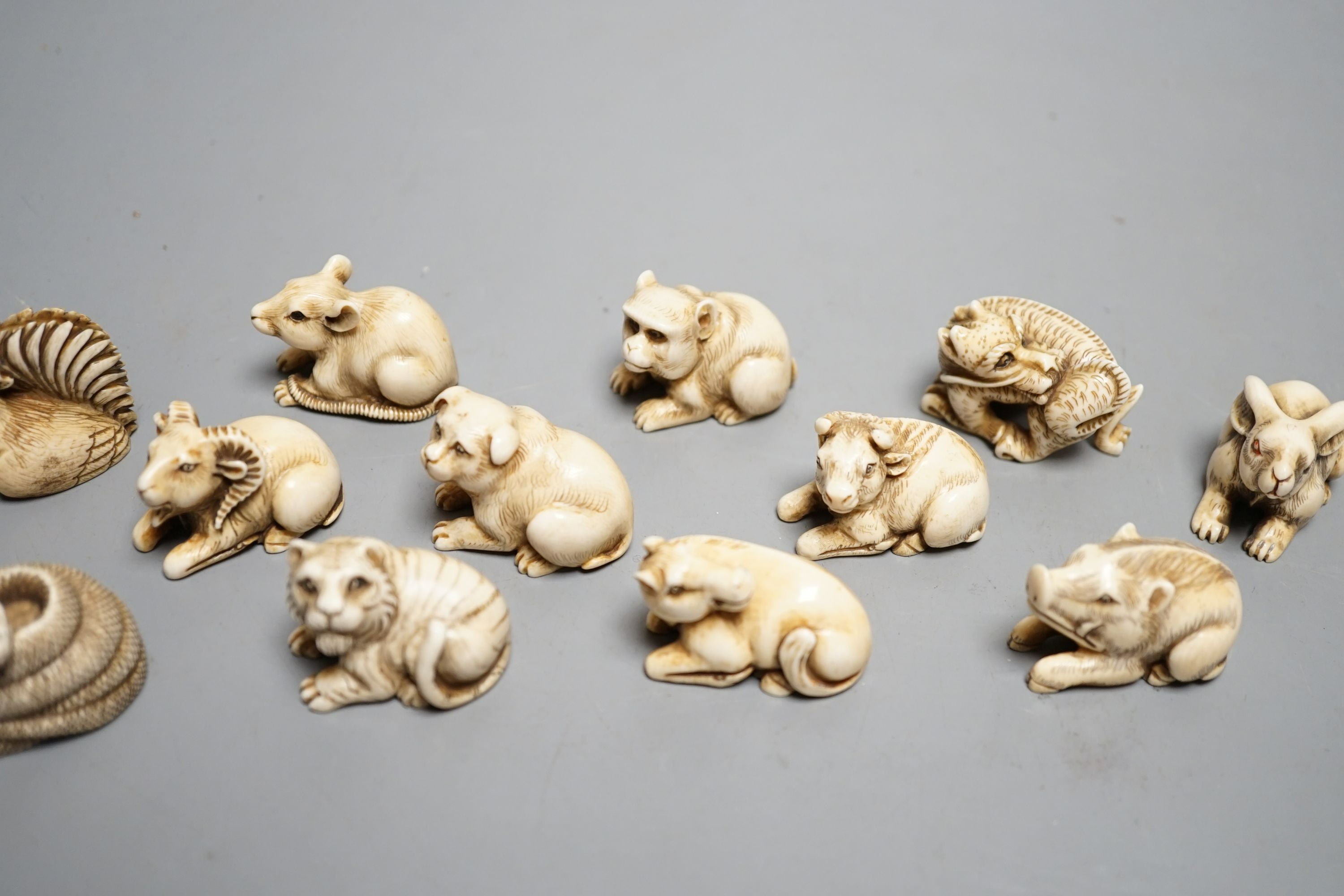 A set of 12 Japanese ivory zodiac animal netsuke, Taisho/early Showa period, signed